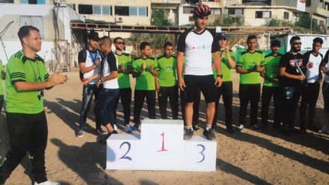 Alaa Al-Dali (C) qualified to be part of the Palestinian cycling team for Asia games. Then he lost his leg during a protest.
