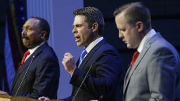 Republican primary senatorial candidate Del. Nick Freitas, gestures as E. W. Jackson, left, and Corey Stewart, right, listen during a debate at Liberty University in Lynchburg, Va., Thursday, April 19, 2018. (AP Photo/Steve Helber)