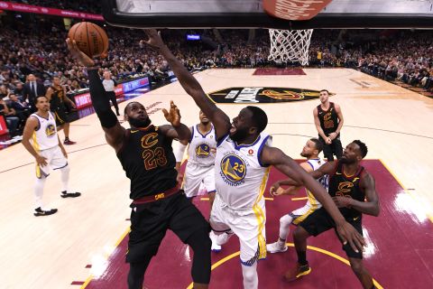 Cleveland's LeBron James is defended by Golden State's Draymond Green during the first half of Game 4. This was the fourth straight season that the two teams met in the Finals. Golden State also won the title in 2015 and 2017. Cleveland won in 2016.