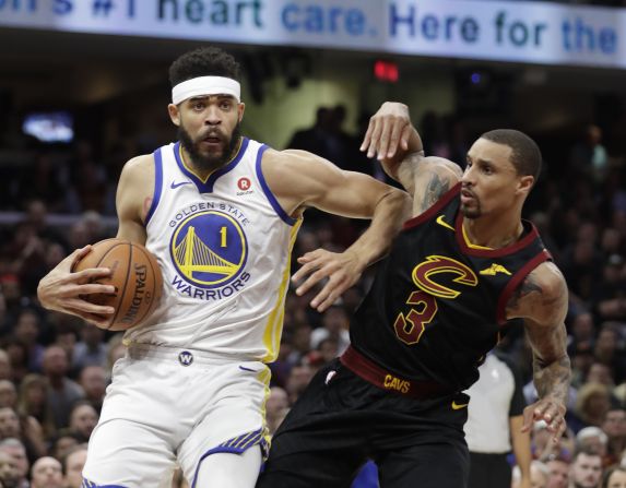 Golden State center JaVale McGee drives past George Hill.