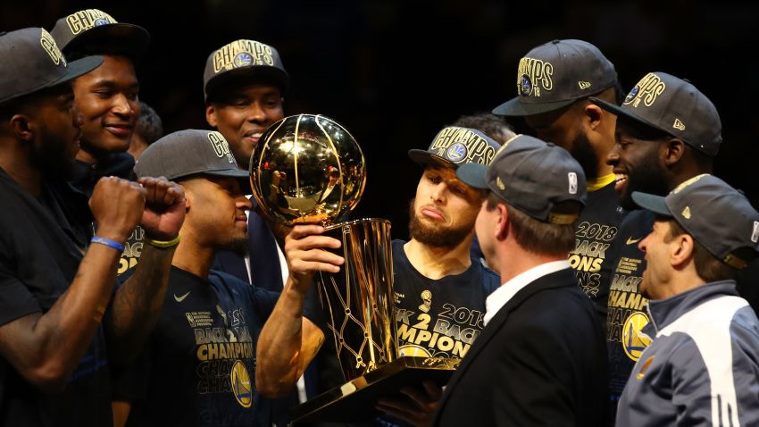 CLEVELAND, OH - JUNE 08:  Stephen Curry #30 of the Golden State Warriors celebrates with the Larry O'Brien Trophy after defeating the Cleveland Cavaliers during Game Four of the 2018 NBA Finals at Quicken Loans Arena on June 8, 2018 in Cleveland, Ohio. The Warriors defeated the Cavaliers 108-85 to win the 2018 NBA Finals. NOTE TO USER: User expressly acknowledges and agrees that, by downloading and or using this photograph, User is consenting to the terms and conditions of the Getty Images License Agreement.  (Photo by Gregory Shamus/Getty Images)