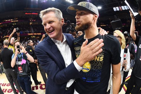 Curry and Warriors head coach Steve Kerr share a moment during the celebration. Kerr has now won eight NBA titles -- five as a player and three as a coach.