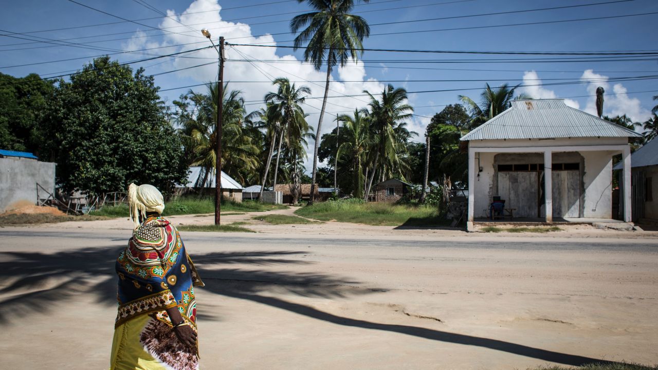 A Mozambican woman walks in the small fishing town of Palma, envisioned as a center for liquefied natural gas development, in February 2017.