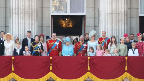 Members of Britain's royal family appear Saturday on the balcony of Buckingham Palace.