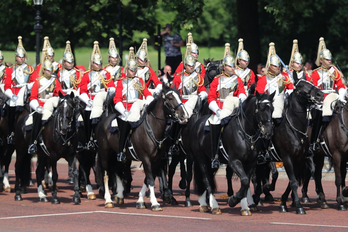 Members of the Queen's personal troops, the Household Division, march on the Mall on Saturday.