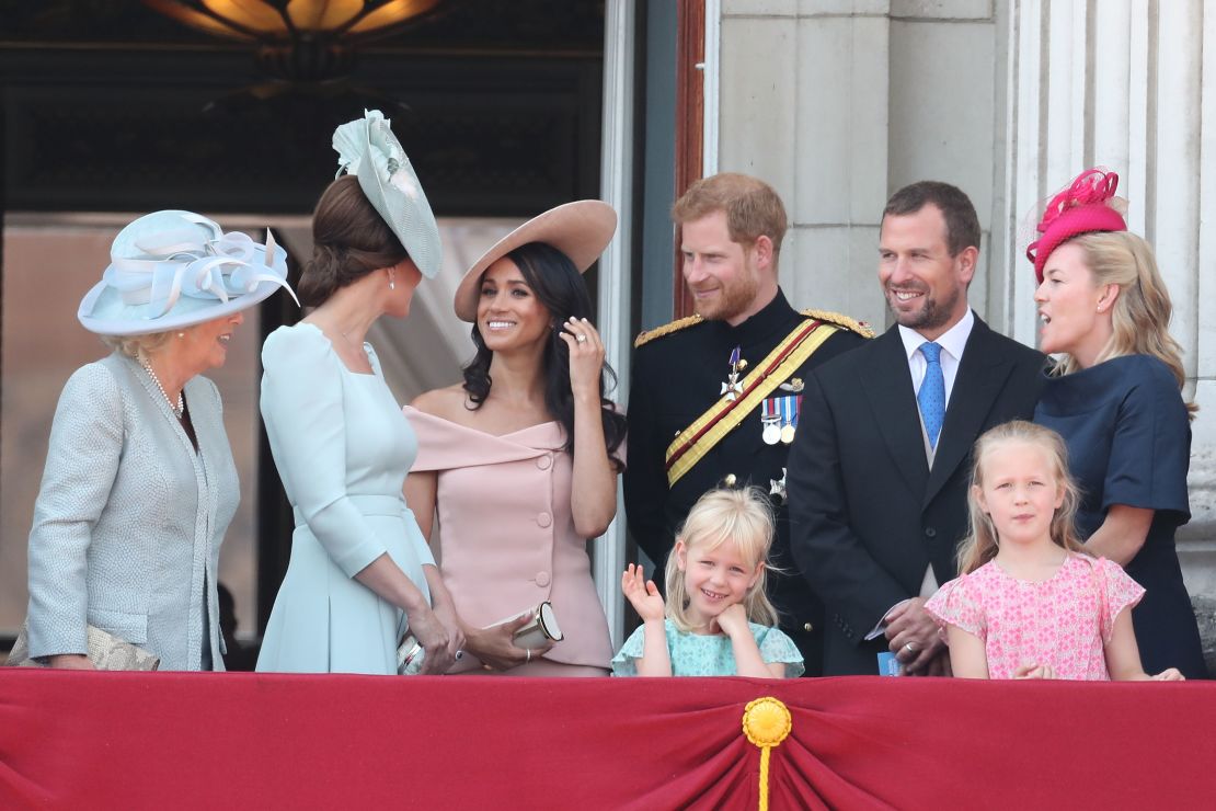 (L-R) The Duchess Of Cornwall, Duchess of Cambridge, Duchess of Sussex, Duke of Sussex, Peter Phillips, Autumn Phillips and their children Isla and Savannah Phillips on the balcony of Buckingham Palace in 2018.