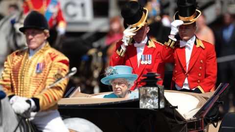 Queen Elizabeth II rides in an open carriage Saturday in the Trooping the Colour parade in London.