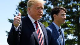 QUEBEC CITY, QC - JUNE 08:  U.S. President Donald Trump (L) gives a thumbs up to the media as he is greeted by Prime Minister of Canada Justin Trudeau during the G7 official welcome at Le Manoir Richelieu on day one of the G7 meeting on June 8, 2018 in Quebec City, Canada. Canada will host the leaders of the UK, Italy, the US, France, Germany and Japan for the two day summit, in the town of La Malbaie.  (Photo by Leon Neal/Getty Images)