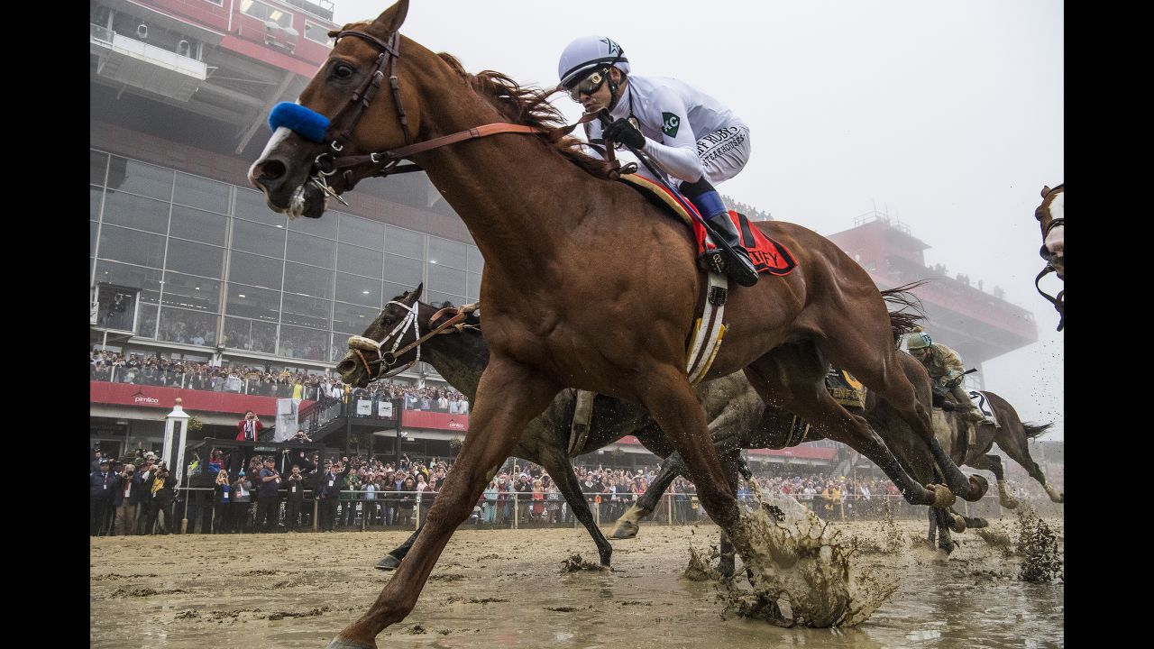 Justify, ridden by jockey Mike Smith, wins the Preakness Stakes at Pimlico Race Course on May 19, 2018, in Baltimore.