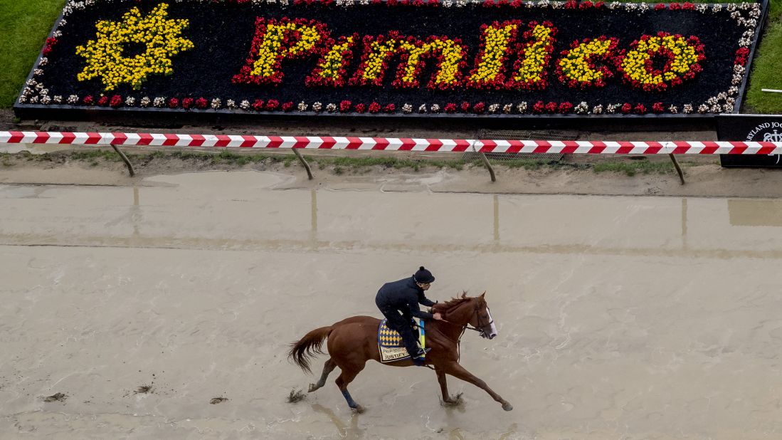 Kentucky Derby winner Justify gallops in preparation for the Preakness at Pimlico Race Course on May 15, 2018, in Baltimore.