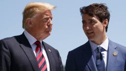 President Donald Trump talks with Canadian Prime Minister Justin Trudeau during a G-7 Summit welcome ceremony, Friday, June 8, 2018, in Charlevoix, Canada. (AP Photo/Evan Vucci)