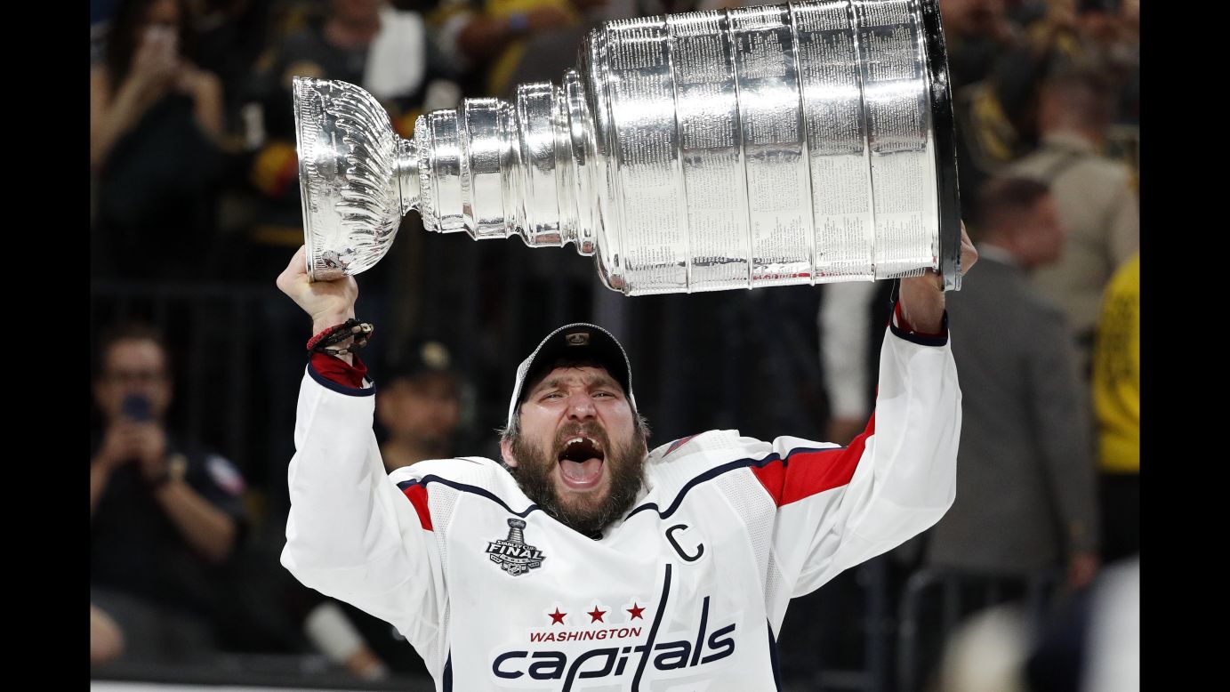 Washington Capitals left wing Alex Ovechkin hoists the Stanley Cup after the Capitals defeated the Golden Knights in Game 5 of the NHL Stanley Cup Finals Thursday, June 7, in Las Vegas. This was the first Stanley Cup title in the Capitals' 44-year history.