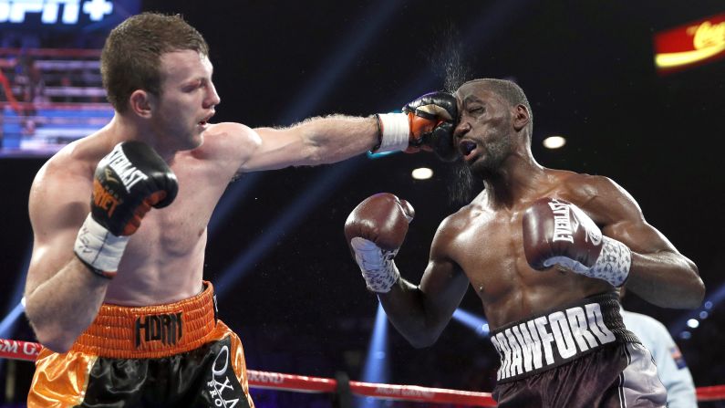 Jeff Horn lands a punch on Terence Crawford in a welterweight title boxing match, Saturday, June 9, in Las Vegas.