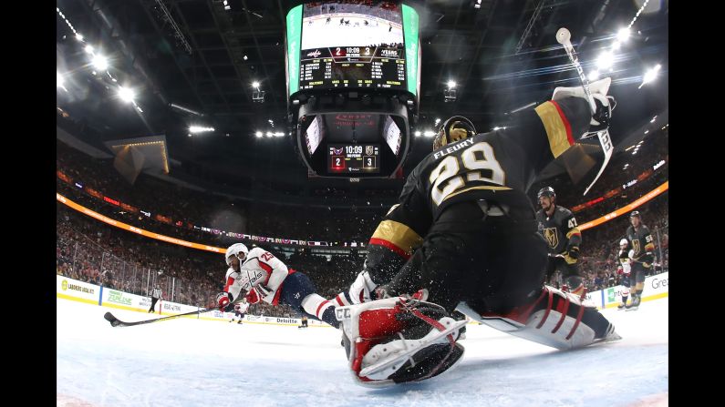 Washington Capitals' Devante Smith-Pelly dives to score a third-period goal in Game 5 of the Stanley Cup Final, tying the game at 3-3. The Capitals won 4-3 on Thursday, June 7, in Las Vegas.