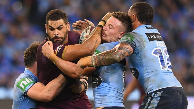 Greg Inglis of the Maroons is tackled during Game 1 of the State Of Origin series between the Queensland Maroons and the New South Wales Blues on Wednesday, June 6, in Melbourne, Australia.