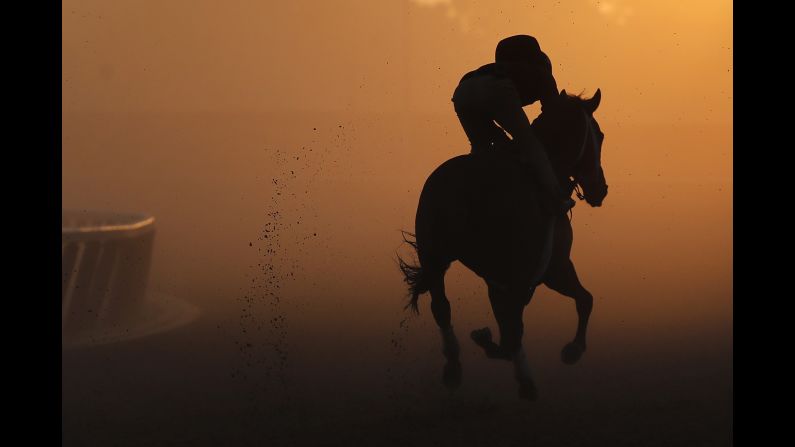 An exercise rider gallops a thoroughbred around the track during a workout at Belmont Park, on Tuesday, June 5 in Elmont, New York. <a href="index.php?page=&url=http%3A%2F%2Fwww.cnn.com%2F2018%2F06%2F03%2Fsport%2Fgallery%2Fwhat-a-shot-sports-0604%2Findex.html" target="_blank">See 22 amazing sports photos from last week </a>