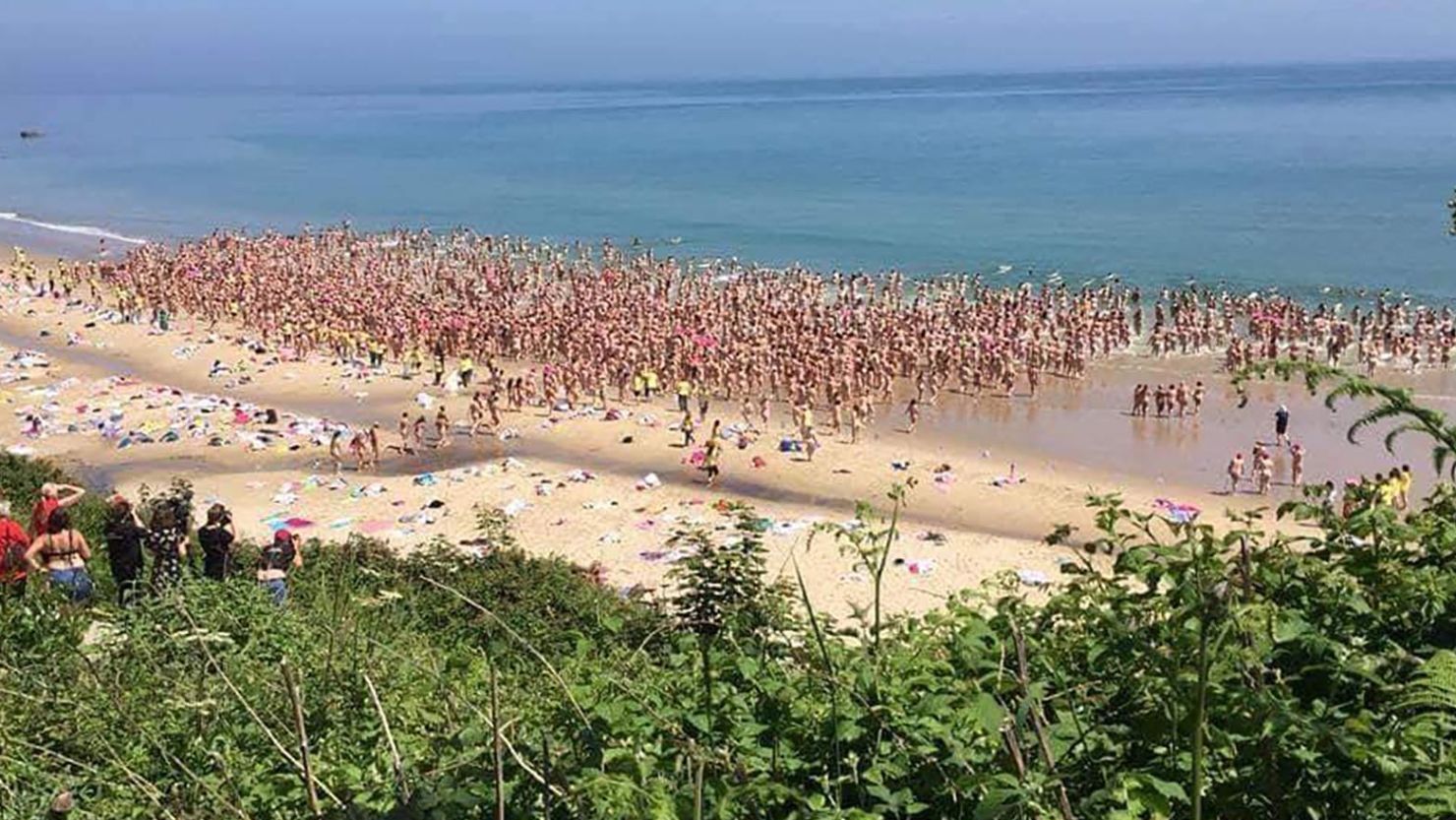 Women gather at Magheramore beach in County Wicklow, Ireland, for the world's largest skinny dip. 