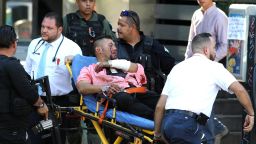 A man wounded during an attack against Secretary of Labour and ex-prosecutor of Jalisco Luis Carlos Najera is assisted in downtown Guadalajara, Jalisco State, Mexico, on May 21, 2018. - Najera was attacked in broad daylight while he was having lunch at a restaurant, officials said. (Photo by ULISES RUIZ / AFP)        (Photo credit should read ULISES RUIZ/AFP/Getty Images)