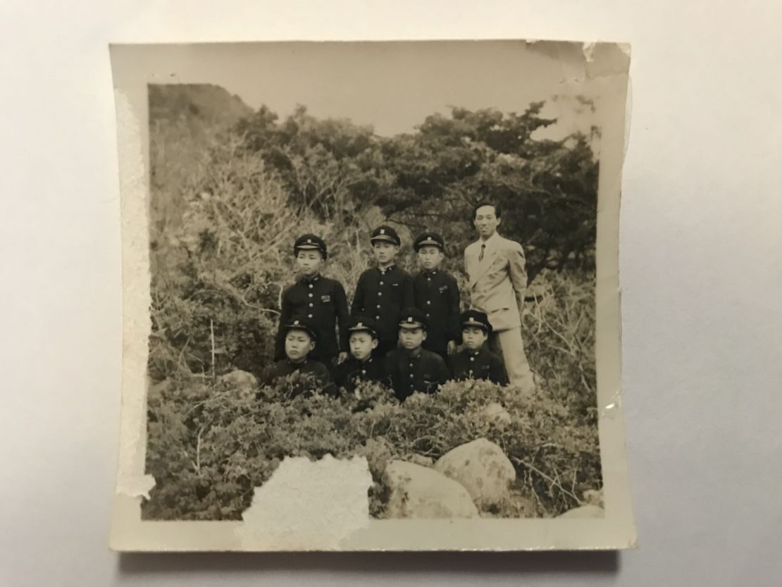 Kyung Joo Lee with a group of children, during his years as a teacher in South Korea.