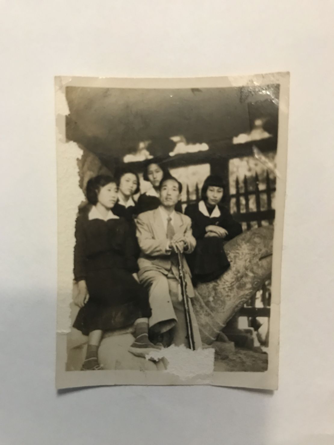 Kyung Joo Lee with a few young female students during his years as a teacher in South Korea.