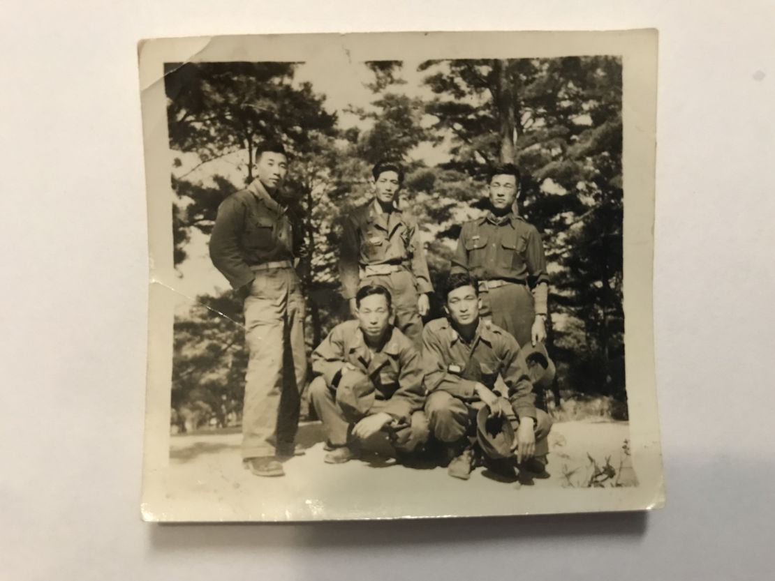 Kyung Joo Lee with his fellow soldiers in the South Korean army (bottom left).