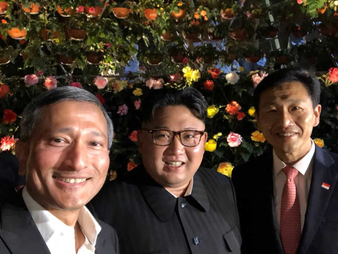 Balakrishnan (L) shared this photo of himself alongside Kim and Singapore's education minister Ong Ye Kung on Monday night. 
