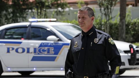 Orlando police Chief John Mina arrives for a news conference during Monday's hostage standoff.