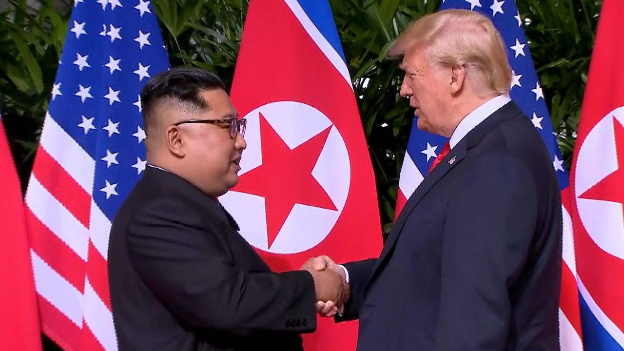 02 trump kim handshake 0611 SCREENGRAB