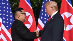 North Korea's leader Kim Jong Un (L) shakes hands with US President Donald Trump (R) at the start of their historic US-North Korea summit, at the Capella Hotel on Sentosa island in Singapore on June 12, 2018. - Donald Trump and Kim Jong Un have become on June 12 the first sitting US and North Korean leaders to meet, shake hands and negotiate to end a decades-old nuclear stand-off. (Photo by SAUL LOEB / AFP)        (Photo credit should read SAUL LOEB/AFP/Getty Images)