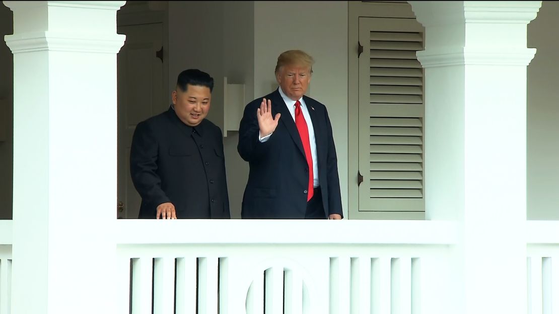 US President Donald Trump and North Korea's leader Kim Jong Un walk through the Capella Hotel after concluding the first series of talks.