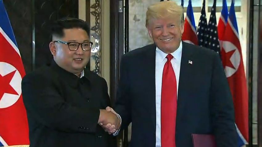 trump kim signing event handshake