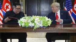 North Korea leader Kim Jong Un and U.S. President Donald Trump exchanged signed documents at the Capella resort on Sentosa Island Tuesday, June 12, 2018 in Singapore.