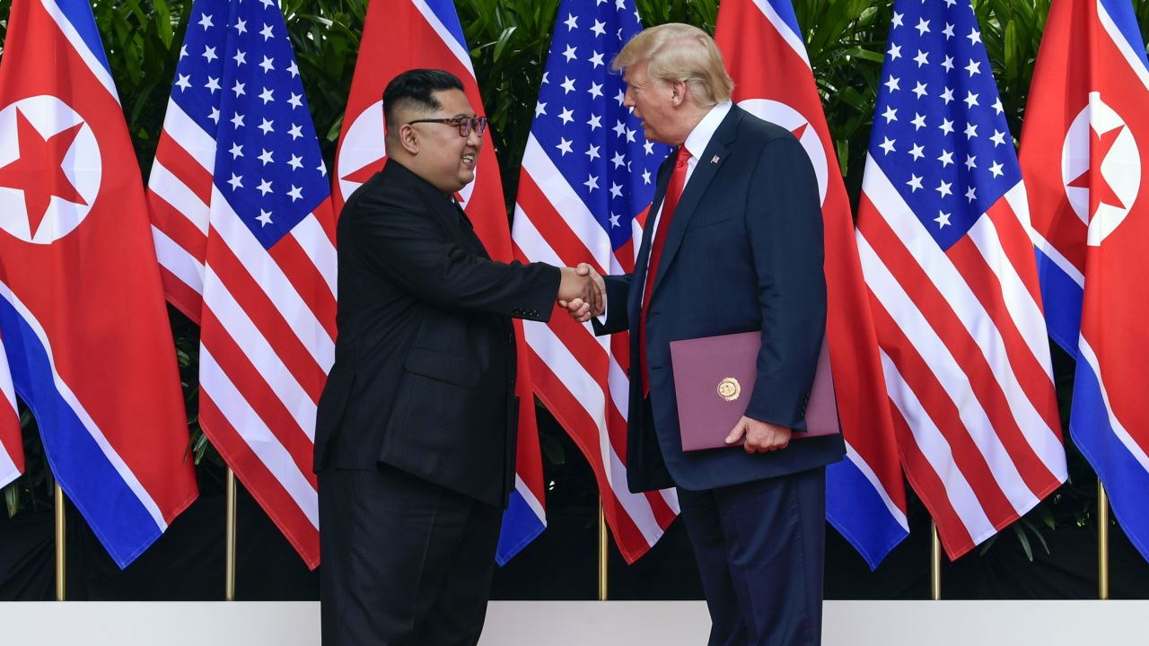 North Korea leader Kim Jong Un (left) and US President Donald Trump shake hands after their meetings at the Capella resort on Sentosa Island in Singapore on June 12.