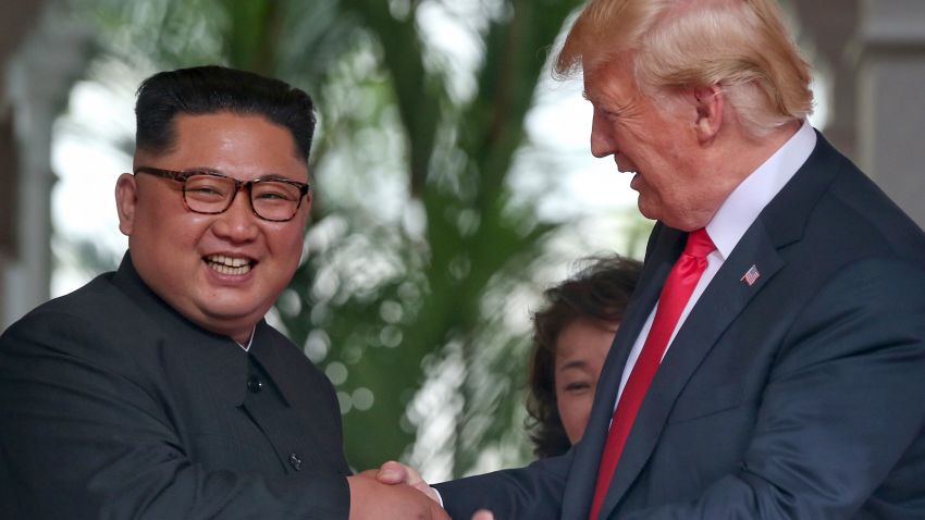 SINGAPORE - JUNE 12: In this handout photo, North Korean leader Kim Jong-un shakes hands with U.S. President Donald Trump during their historic U.S.-DPRK summit at the Capella Hotel on Sentosa island on June 12, 2018 in Singapore. U.S. President Trump and North Korean leader Kim Jong-un held the historic meeting between leaders of both countries on Tuesday morning in Singapore, carrying hopes to end decades of hostility and the threat of North Korea's nuclear program. (Photo by Kevin Lim/THE STRAITS TIMES/Handout/Getty Images)
