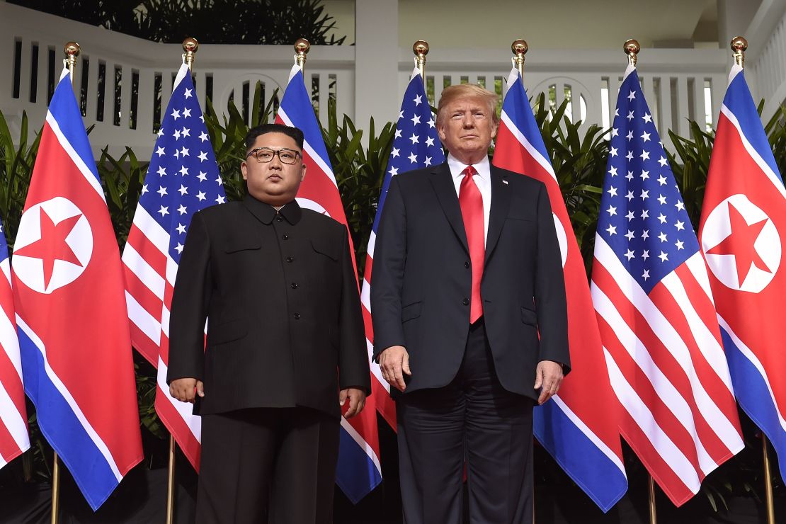 TOPSHOT - US President Donald Trump (R) poses with North Korea's leader Kim Jong Un (L) at the start of their historic US-North Korea summit, at the Capella Hotel on Sentosa island in Singapore on June 12, 2018. - Donald Trump and Kim Jong Un have become on June 12 the first sitting US and North Korean leaders to meet, shake hands and negotiate to end a decades-old nuclear stand-off. (Photo by SAUL LOEB / AFP) (Photo credit should read SAUL LOEB/AFP/Getty Images)