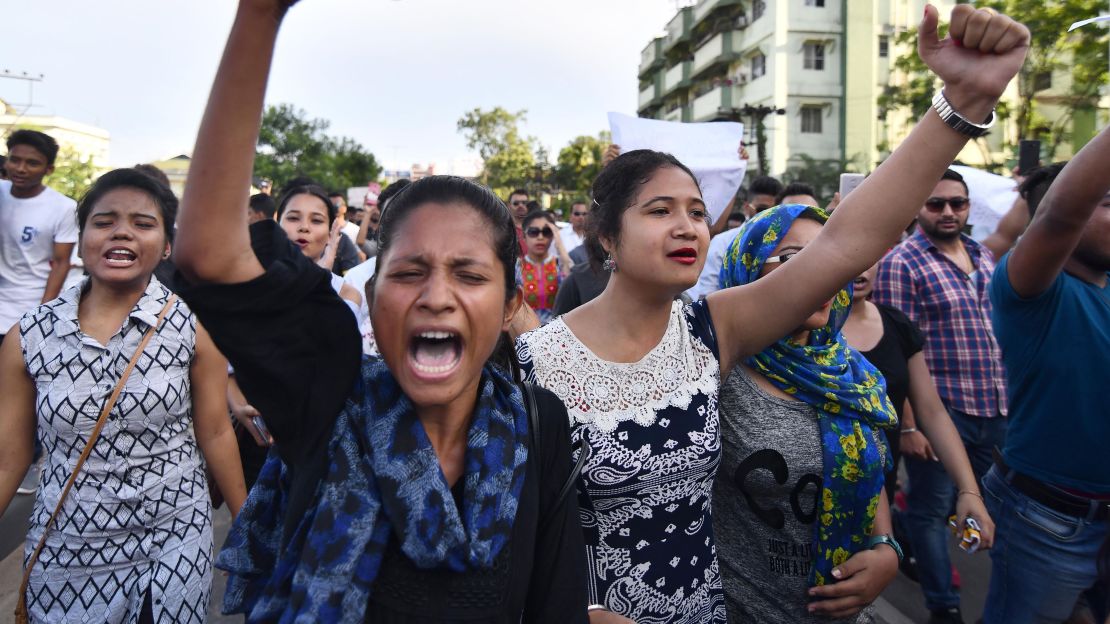 Indian students take part in a protest march demanding action over the killing of two men in the Karbi Anglong district of Assam.