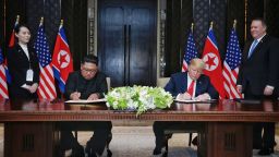 SINGAPORE, SINGAPORE - JUNE 12:  In this handout photograph provided by The Strait Times, North Korean leader Kim Jong-un (L) with U.S. President Donald Trump (R) during their historic U.S.-DPRK summit at the Capella Hotel on Sentosa island on June 12, 2018 in Singapore. U.S. President Trump and North Korean leader Kim Jong-un held the historic meeting between leaders of both countries on Tuesday morning in Singapore, carrying hopes to end decades of hostility and the threat of North Korea's nuclear programme. (Photo by Kevin Lim/The Strait Times/Handout/Getty Images)