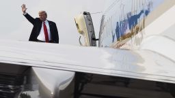 US President Donald Trump waves from Air Force One after the historic US-North Korea summit in Singapore on June 12, 2018. - Trump and North Korean leader Kim Jong Un hailed their historic summit on June 12 as a breakthrough in relations between Cold War foes, but the agreement they produced was short on details about the key issue of Pyongyang's nuclear weapons. (Photo by SAUL LOEB / AFP)        (Photo credit should read SAUL LOEB/AFP/Getty Images)