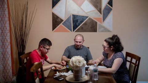 Kevin Portillo has dinner with his mother and father, Sylvia and Luis.