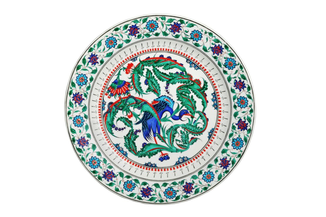 A contemporary interpretation of "Iznik" tilework by Turkish ceramics artist Mehmet Gursoy, who nods to the tradition of his craft through Chinese motifs like cranes and lotus flowers.