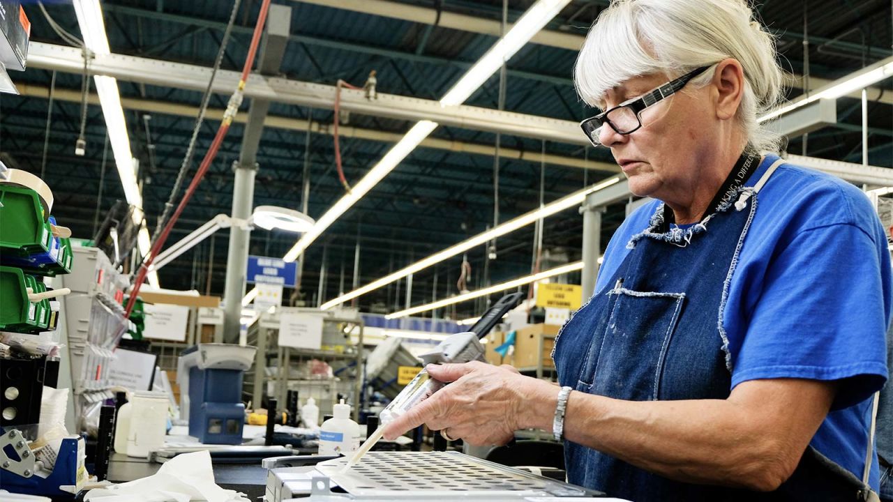 <strong>Central tray table:</strong> Kay, a Zodiac Aerospace employee for 40 years, assemble the central tray table component. 