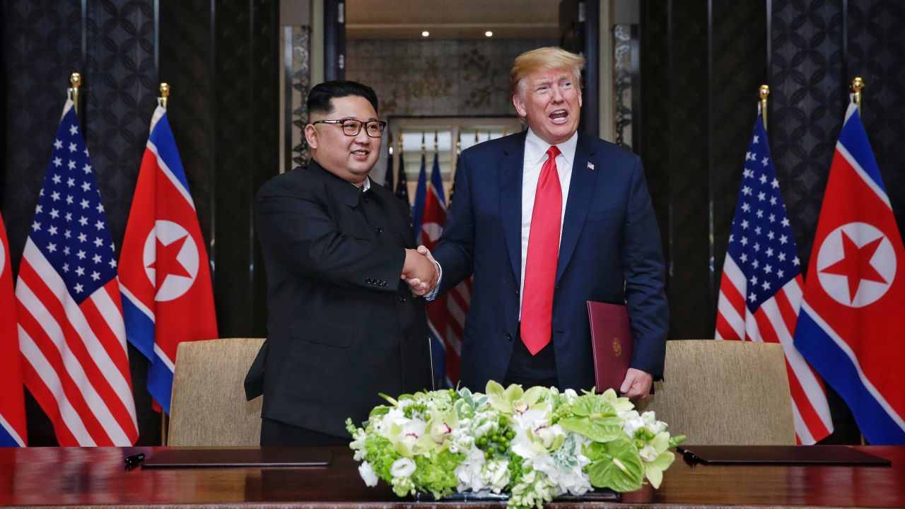 SINGAPORE, SINGAPORE - JUNE 12:  In this handout photograph provided by The Strait Times, North Korean leader Kim Jong-un (L) with U.S. President Donald Trump (R) during their historic U.S.-DPRK summit at the Capella Hotel on Sentosa island on June 12, 2018 in Singapore. U.S. President Trump and North Korean leader Kim Jong-un held the historic meeting between leaders of both countries on Tuesday morning in Singapore, carrying hopes to end decades of hostility and the threat of North Korea's nuclear programme. (Photo by Kevin Lim/The Strait Times/Handout/Getty Images)