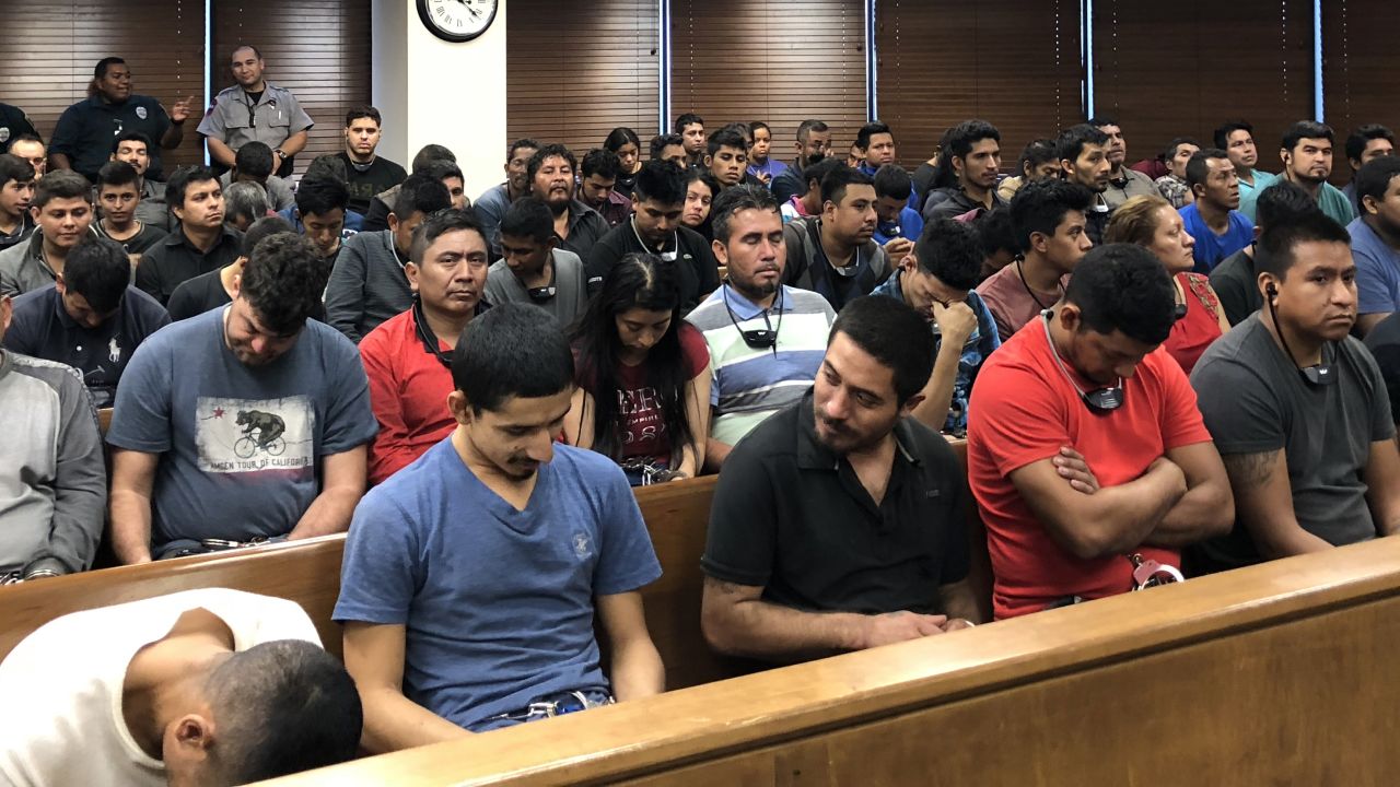 The scene Monday in a federal courthouse in McAllen, Texas, where defendants are facing a federal misdemeanor charge of illegally entering the United States. 