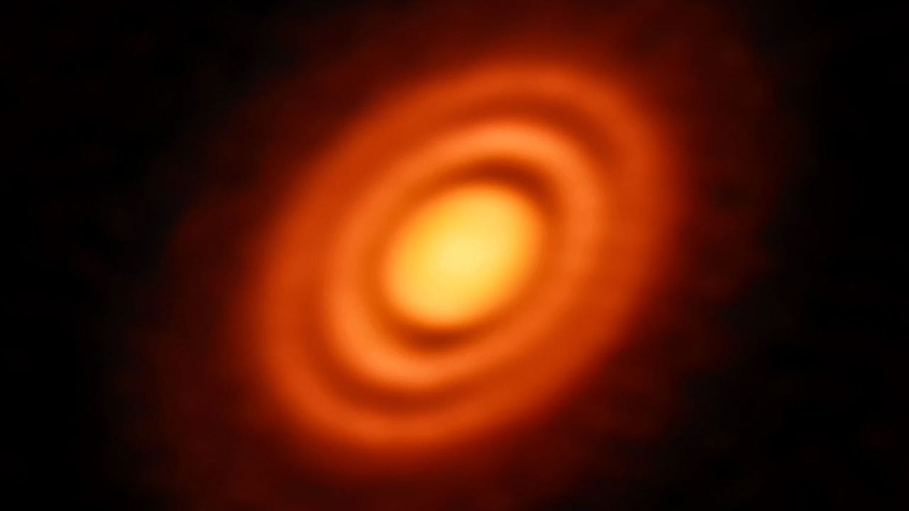 Our Solar System formed out of a huge, primordial cloud of gas and dust. The vast majority of that cloud formed the Sun, while the leftover disc of rotating material around it eventually coalesced into the orbiting planets we know — and live on — today. Astronomers can observe similar processes happening around other stars in the cosmos. This splendid Picture of the Week shows a disc of rotating, leftover material surrounding the young star HD 163296. Using the observing power of the Atacama Large Millimeter/submillimeter Array (ALMA) in Chile, astronomers have been able to discern specific features in the disc, including concentric rings of material surrounding the central star. They were even able to use ALMA to obtain high-resolution measurements of the gas and dust constituents of the disc. With these data they could infer key details of the formation history of this young stellar system. The three gaps between the rings are likely due to a depletion of dust and in the middle and outer gaps astronomers also found a lower level of gas. The depletion of both dust and gas suggests the presence of newly formed planets, each around the mass of Saturn, carving out these gaps on their brand new orbits.