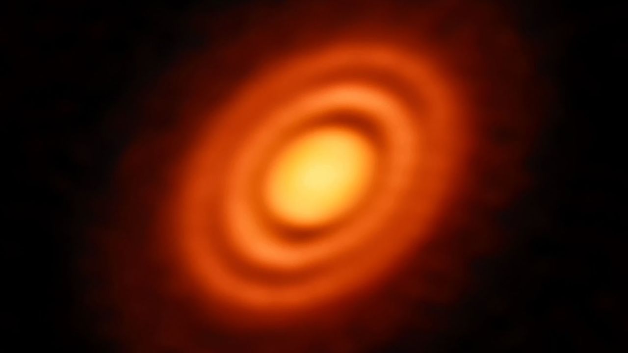 A disc of rotating dust and gas surrounding the young star HD 163296. 