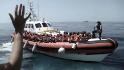 This undated photo released on Tuesday, June 12, 2018, by French NGO "SOS Mediterranee", shows stranded migrants aboard a Italian Coast Guard boat as they are transferred from the SOS Mediterranee's Aquarius ship  to Italian ships to continue the journey to Spain in the Mediterranean Sea. Italy dispatched two ships Tuesday to help take 629 migrants stuck off its shores on the days-long voyage to Spain in what is forecast to be bad weather, after the new populist government refused them safe port in a dramatic bid to force Europe to share the burden of unrelenting arrivals. (Kenny Karpov/SOS Mediterranee via AP)