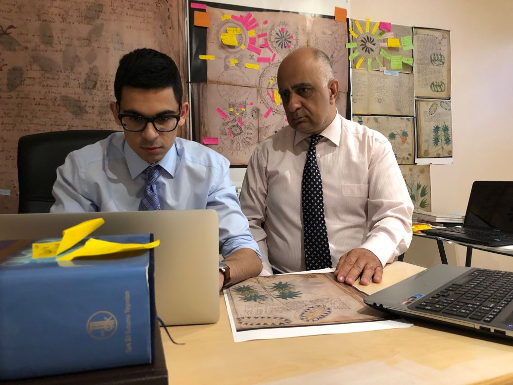A family in Alberta, Canada, believes the manuscript is written in Old Turkic. Father and son Ahmet (R) and Ozan Ardic have been working on decoding the manuscript for three years. They say they have derived an alphabet of 24 base characters and 64 combined characters from it.