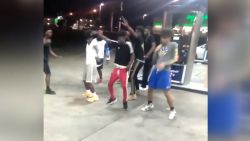 Dancing teens gas station 