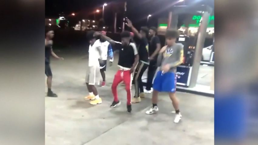 Dancing teens gas station