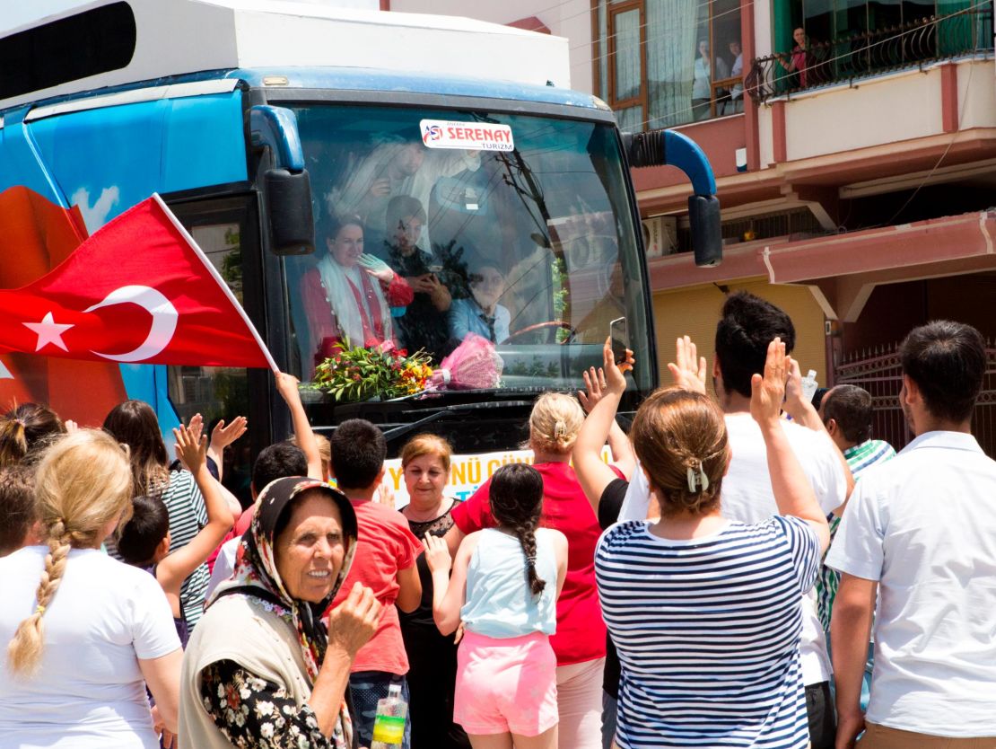 People from the small southern town of Samandag welcome Aksener on the street.